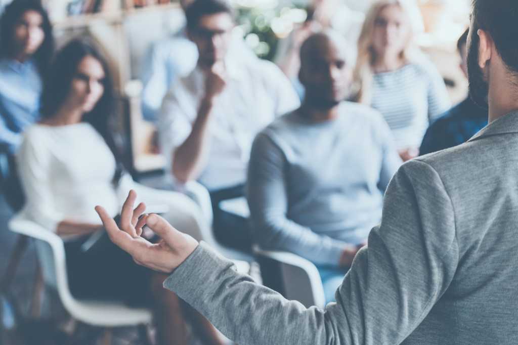 man gesturing lecturing pitching idea presentation storytelling by g stockstudio getty images